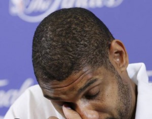 Spurs' Duncan reacts during a press conference after his team lost Game 7 to the Heat of their NBA Finals basketball playoff in Miami