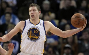 April 15, 2013; Oakland, CA, USA; Golden State Warriors power forward David Lee (10) controls the pass against San Antonio Spurs point guard Nando de Colo (25) during the third quarter at Oracle Arena. The Golden State Warriors defeated the San Antonio Spurs 116-106. Mandatory Credit: Kelley L Cox-USA TODAY Sports