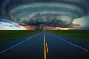Single lane road leading to super-cell tornado