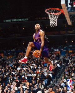 Vince Carter shoots during the All Star Weekend slam dunk contest.
