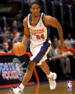 PLEASE NOTE THIS IMAGE IS FOR USE VIA THE CONSUMER POD SITE ONLY. LOS ANGELES - OCTOBER 13:  Andre Miller #24 of the Los Angeles Clippers dribbles the ball during the NBA preseason game against the Memphis Grizzlies on October 13, 2002 at the Staples Center in Los Angeles, California.  The Clippers won 106-96.  NOTE TO USER: User expressly acknowledges and agrees that, by downloading and or using this photograph, User is consenting to the terms and conditions of the Getty Images License Agreement. Mandatory copyright notice: Copyright NBAE 2002 (Photo by Andrew D. Bernstein/NBAE/Getty Images)