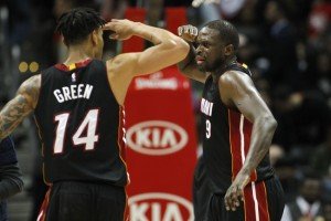 Feb 19, 2016; Atlanta, GA, USA; Miami Heat forward Gerald Green (14) and forward Luol Deng (9) salute each other against the Atlanta Hawks in the fourth quarter at Philips Arena. The Heat defeated the Hawks 115-111. Mandatory Credit: Brett Davis-USA TODAY Sports