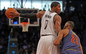 Mar 27, 2015; Brooklyn, NY, USA; Cleveland Cavaliers forward LeBron James (23) defends Brooklyn Nets forward Joe Johnson (7) during the second half at Barclays Center. The Nets defeated the Cavaliers 106 - 98. Mandatory Credit: Adam Hunger-USA TODAY Sports